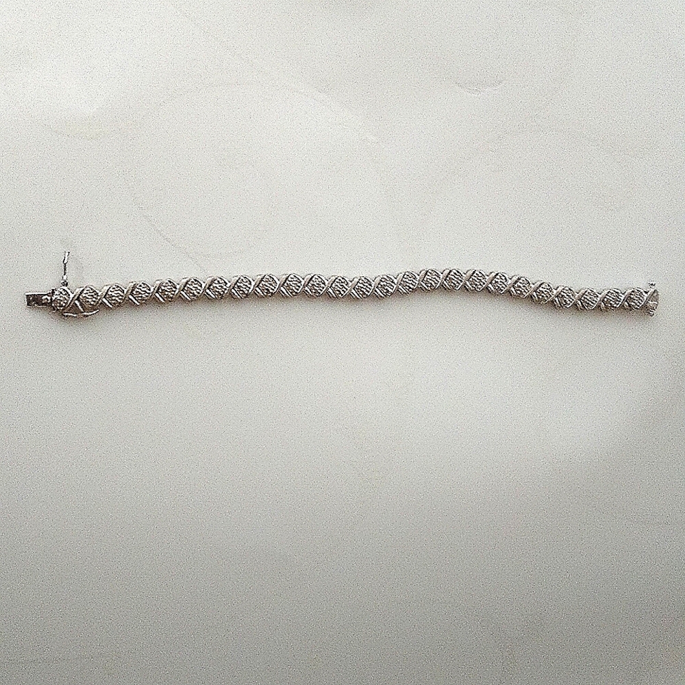Diamond tennis bracelet 7 inches long OTC925 marking on one end.